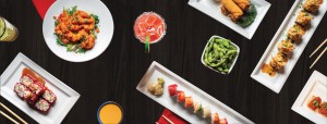 Assorted dishes on a dark table, including spicy shrimp, sushi rolls like Rainbow Roll and Viva Las Vegas Roll, nigiri, crispy rice with spicy tuna, edamame, spring rolls, gyoza dumplings, and colorful cocktails.