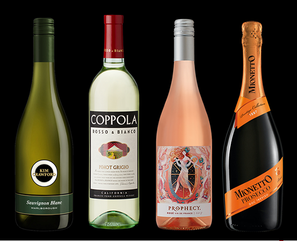 Four bottles of wine and sparkling wine standing side by side against a black background.
